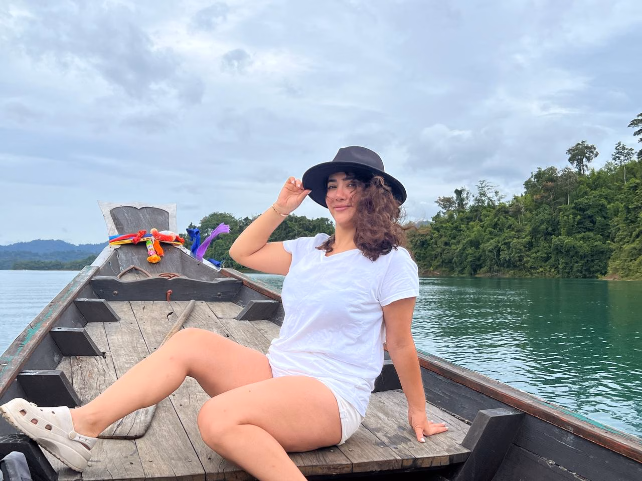 Sarah on a long boat in Thailand