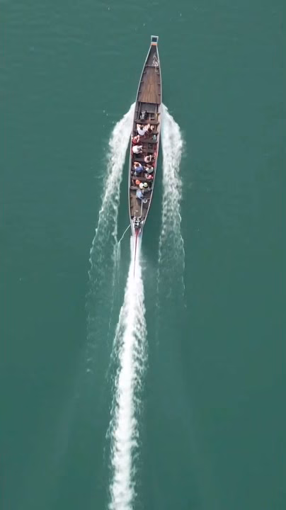 Aerial view of a longtail boat on Cheow Lan Lake